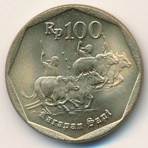 Монета 100 рупий. 1998г. Индонезия. Погонщики коров. (F)